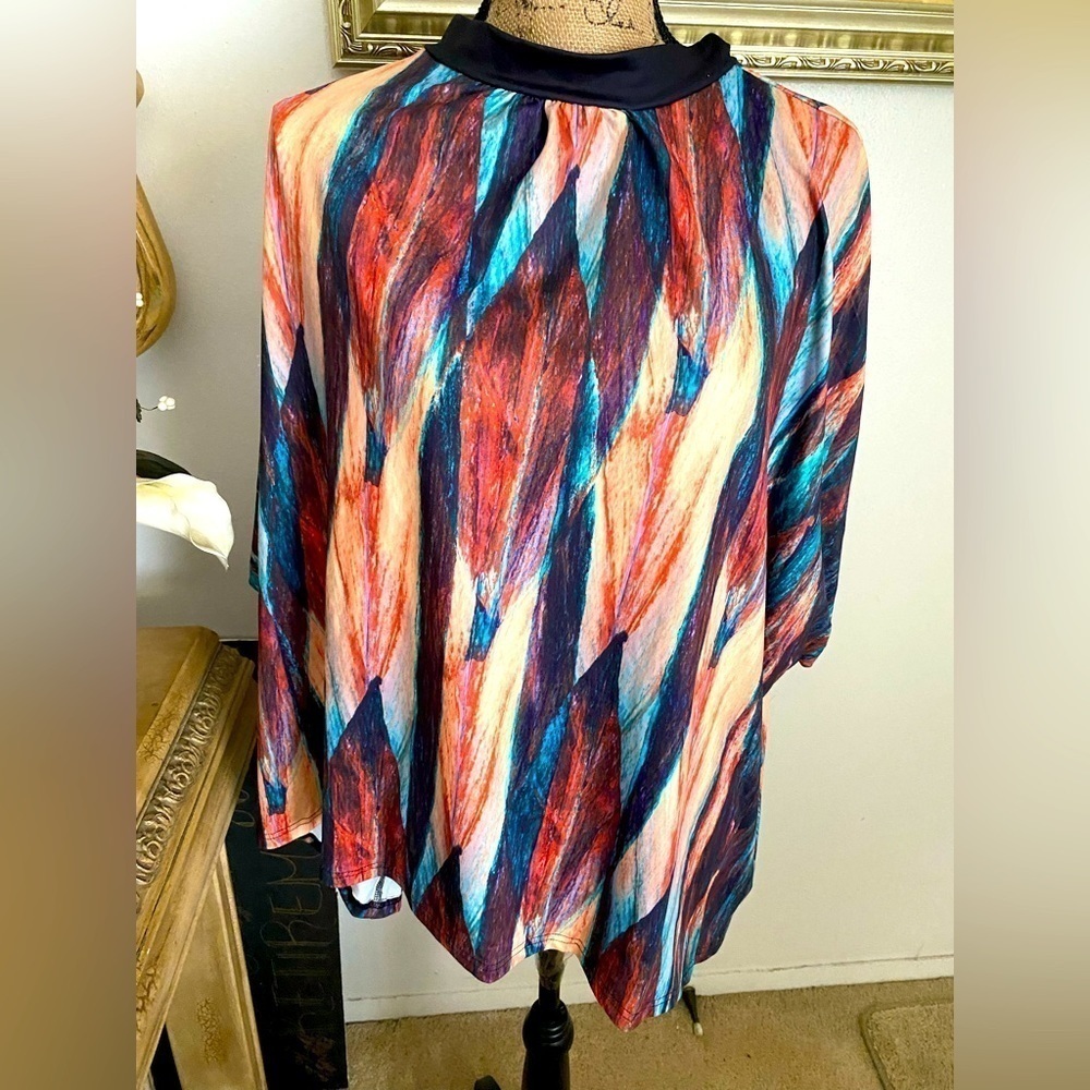 NEW Pixie Lady multi color tunic with a tie in the back. Size XL.